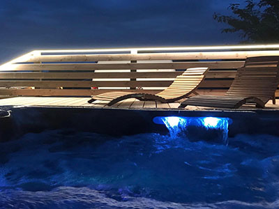 hot tub at night, blue lighting.