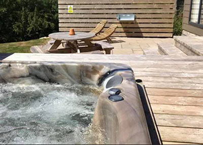 hot tub, patio and garden.